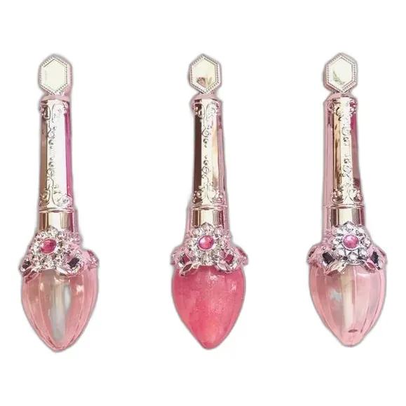Jewelry-style lip gloss wands with golden caps and heart-shaped gloss tips