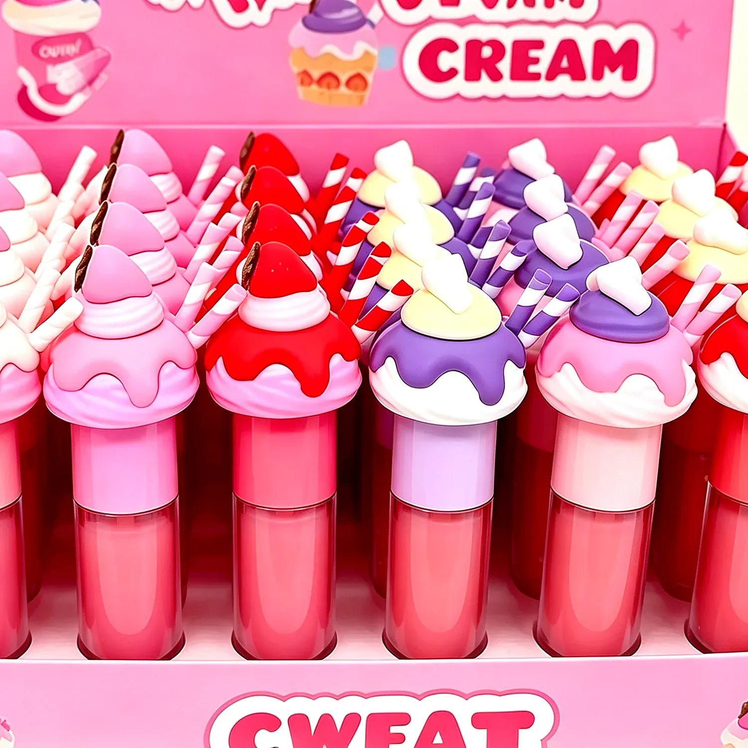 Printed counter display holding cone-shaped lip glosses with swirl tops in pastel colours
