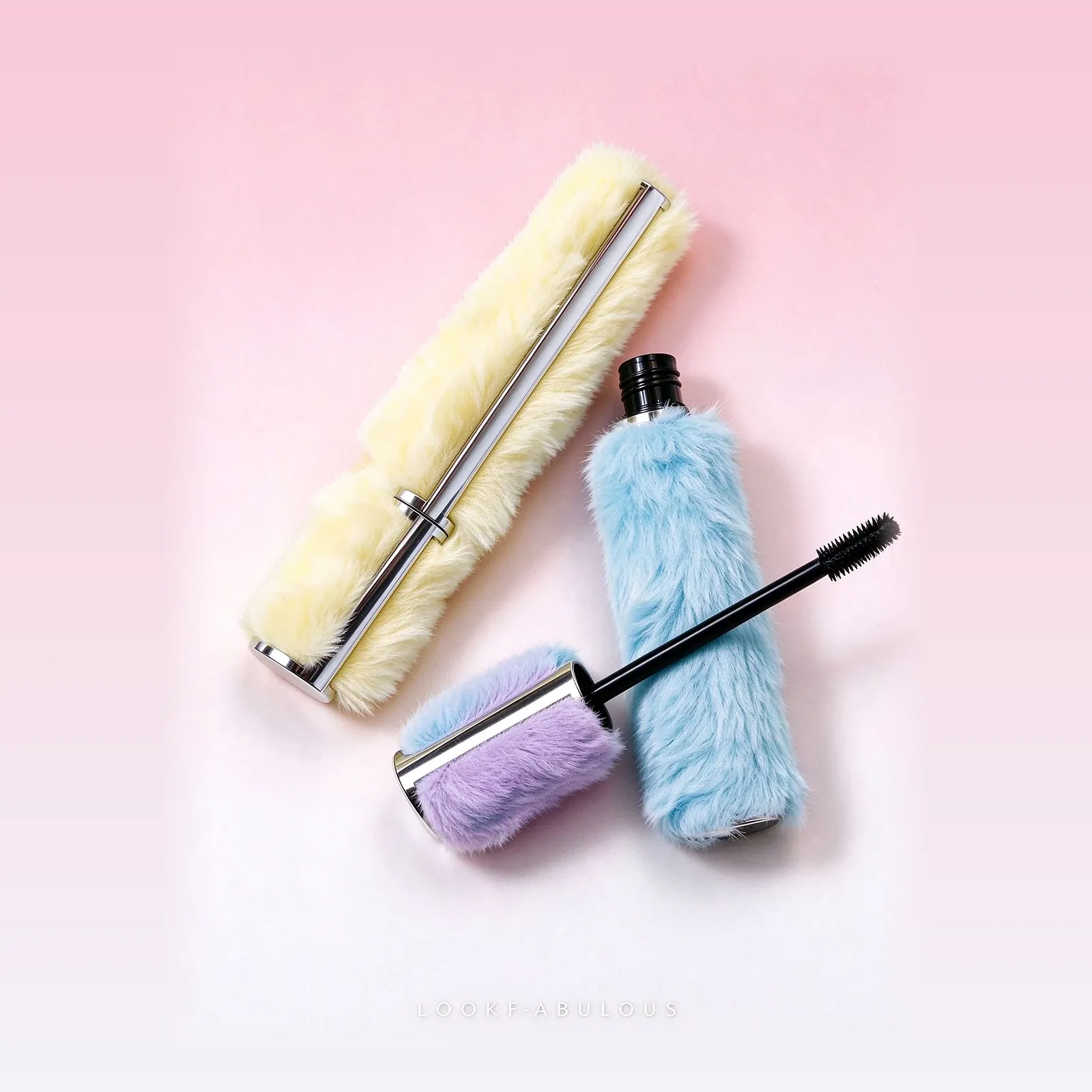 Yellow, blue and purple fluffy wrapped mascara tubes with silver bands