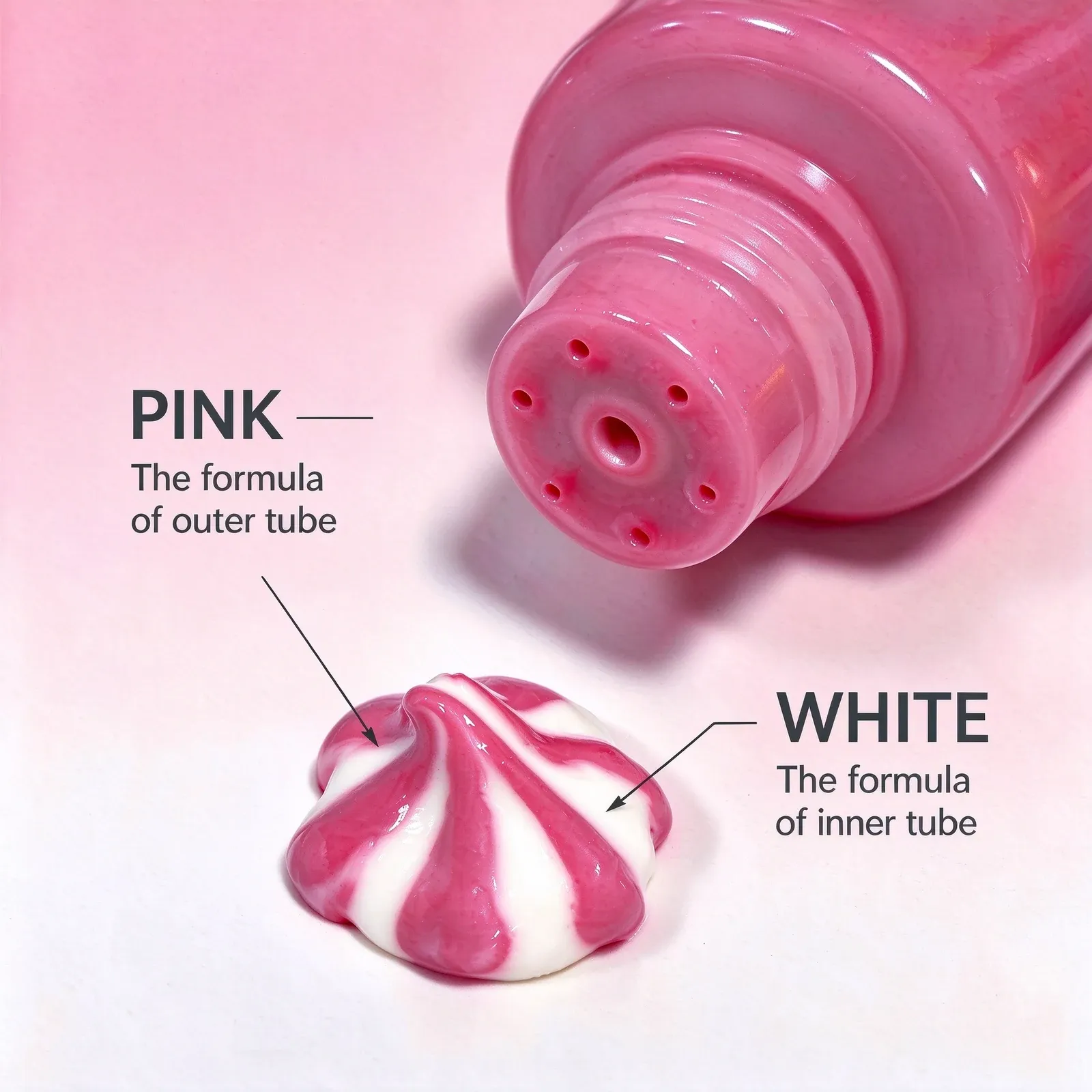 Pink hand cream tube with a two-tone pink and white cream swirl on a pink background