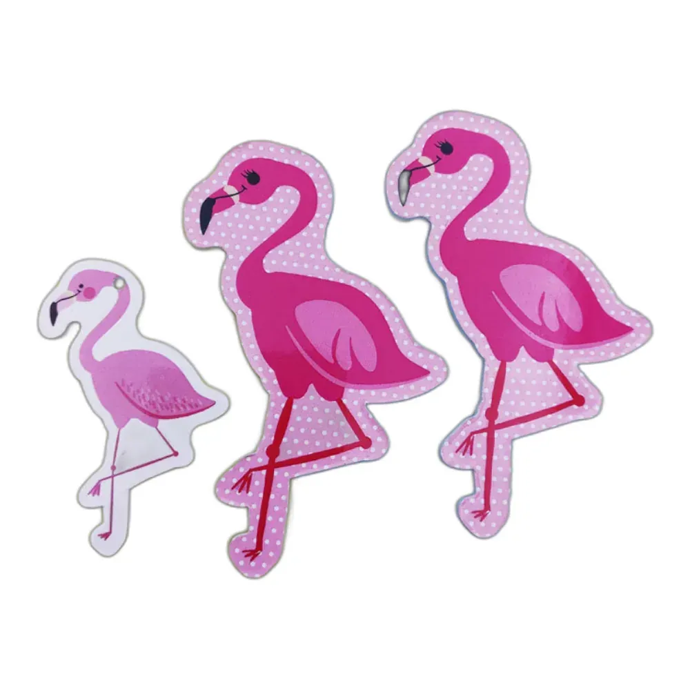 Pink flamingo shaped nail files on pink polka-dot boards