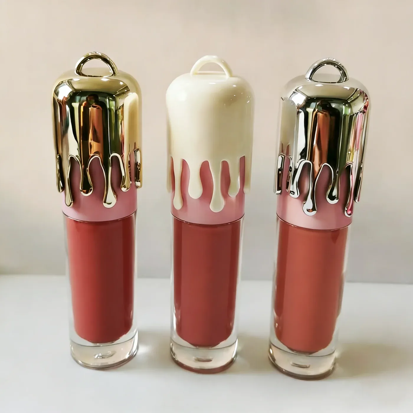 Novelty lip gloss trio with metallic drip caps