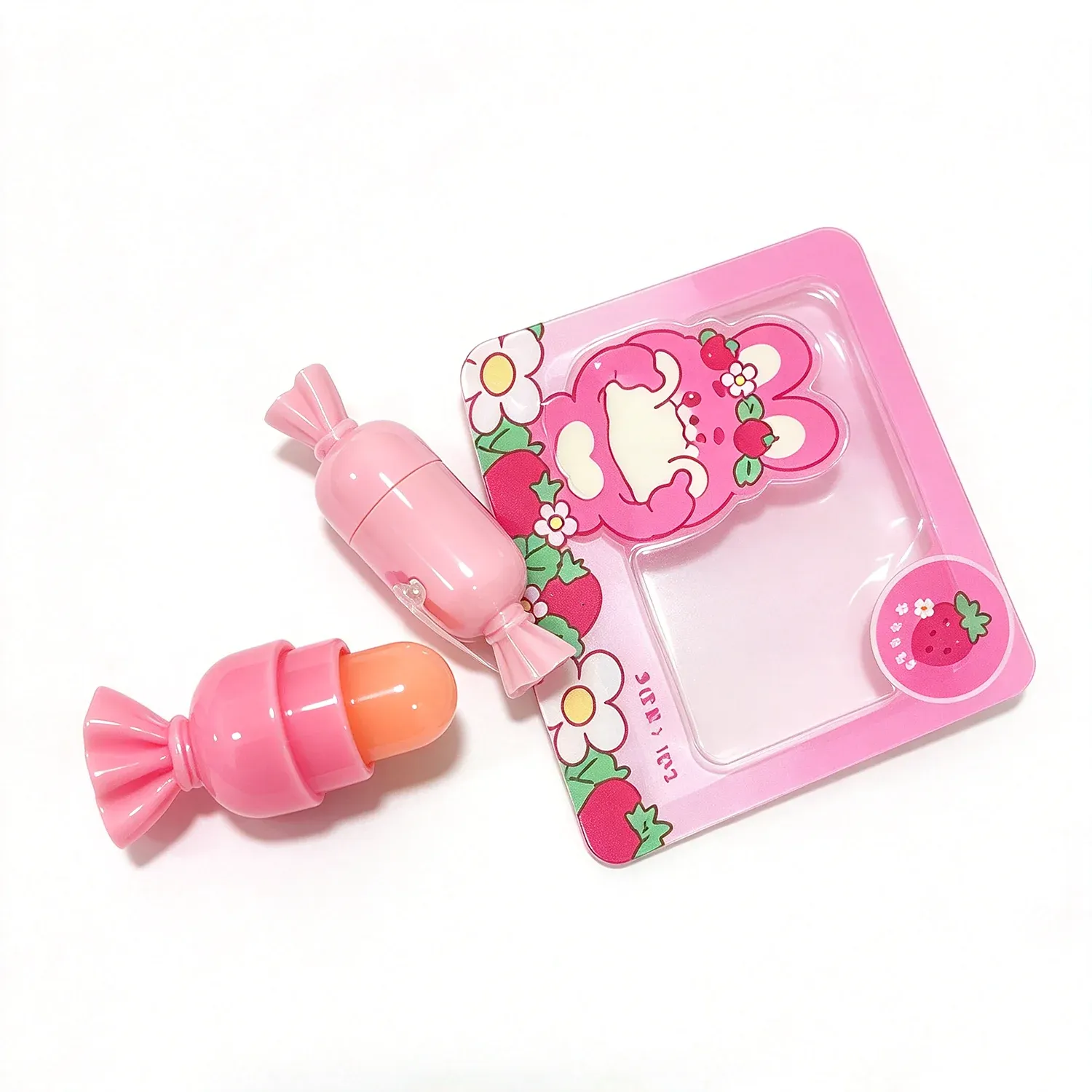 Pink notebook shaped palette with a bow and small colour pans