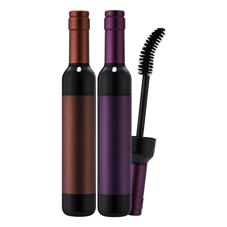 Mascara molded as a miniature wine bottle in bronze and purple with spoolie shown