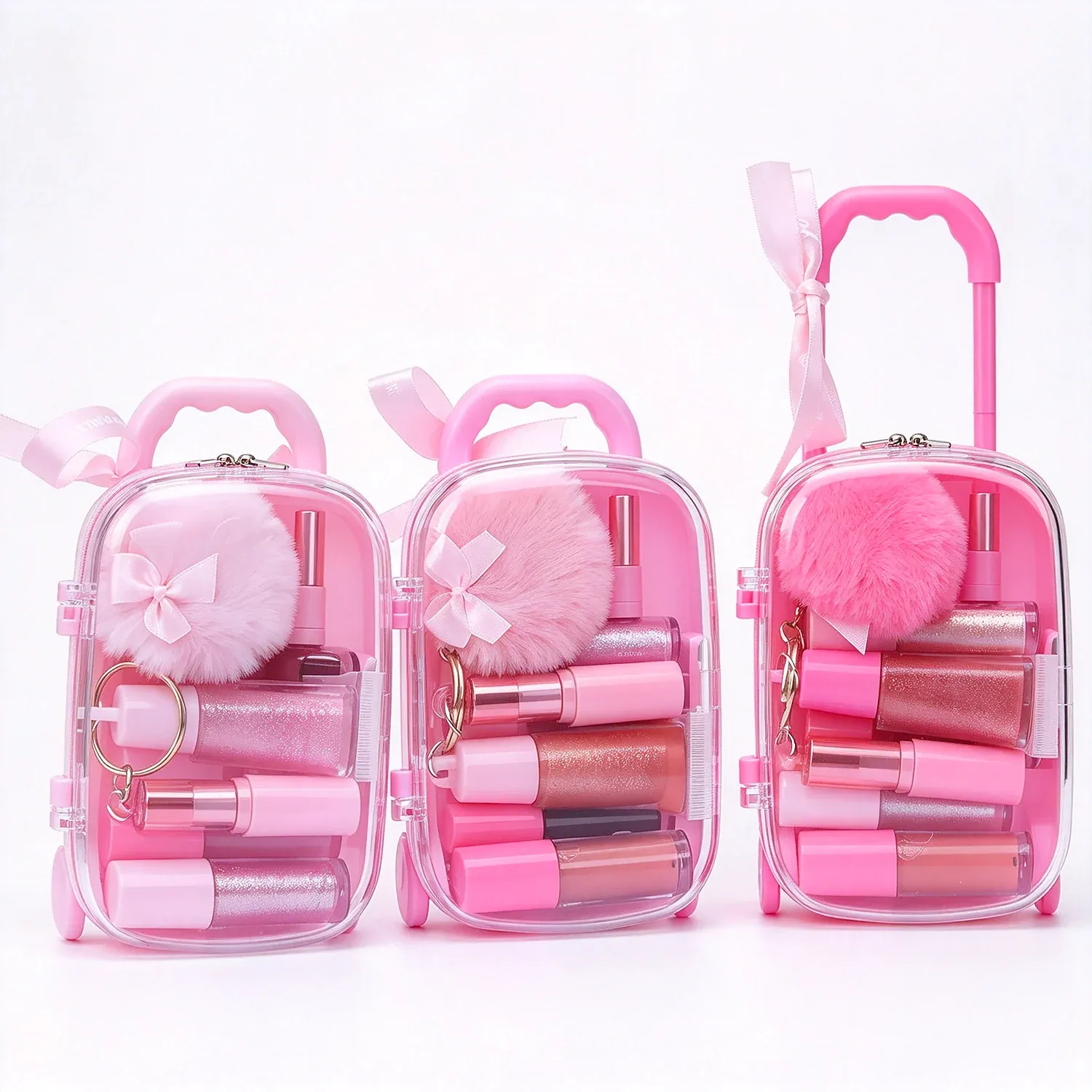 Three pink bag shaped palettes with small colour pans and handles