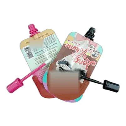 Two squeeze-pouch applicators from the pouch line shown with their wands out