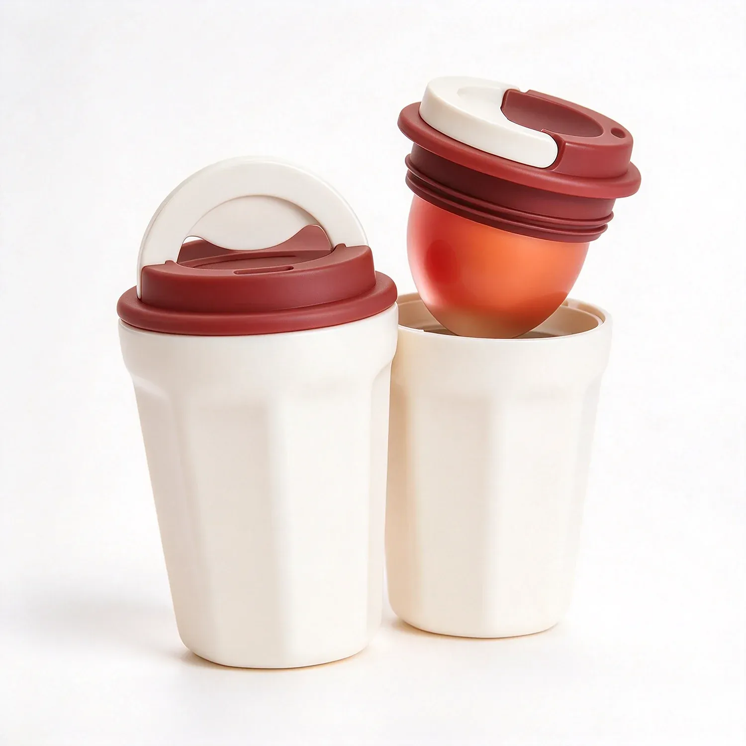 Two takeaway coffee cups with domed lids used as lip gloss cases