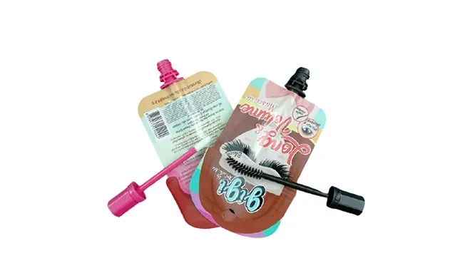 Two squeeze-pouch applicators from the pouch line shown with their wands out