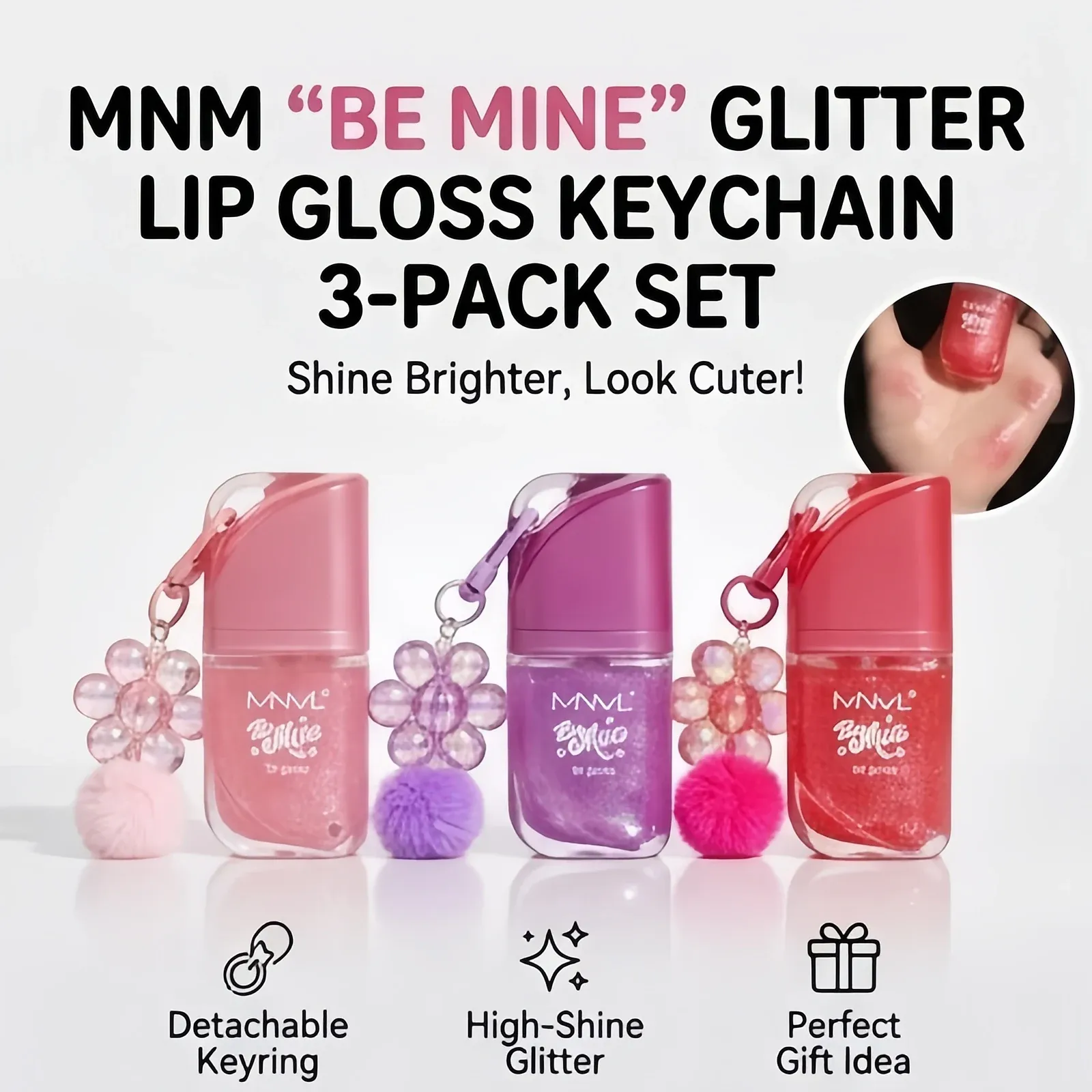 Glitter Lip Gloss Keychain Set - Three rounded-rectangle clear gloss tubes filled with pink, purple and red glitter, topped with slanted caps and clipped to clear flower charms and matching pom-poms.