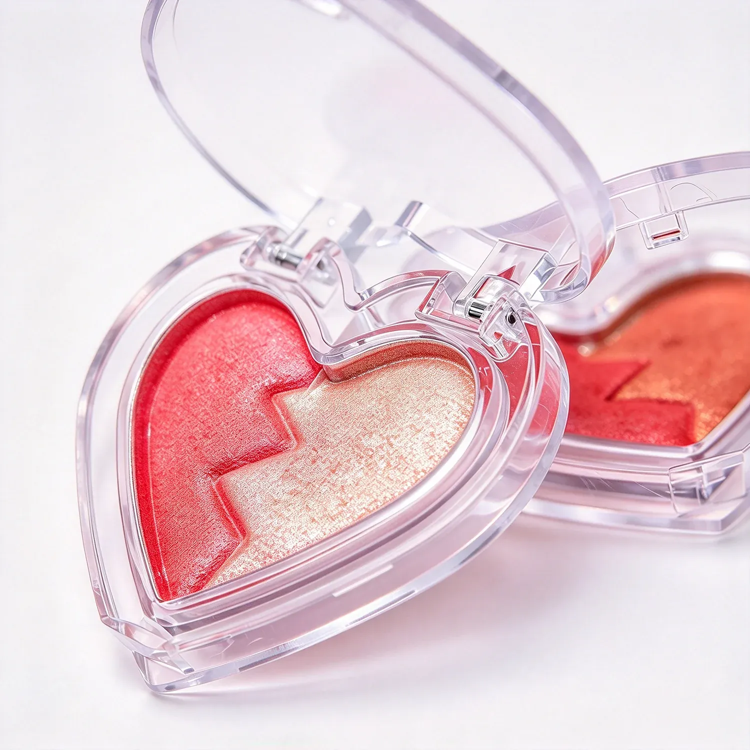Heart shaped blush compact with a powder pan and a puff