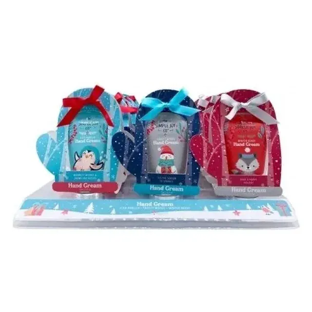 Tray display of three hand cream pouches in mitten themed packaging