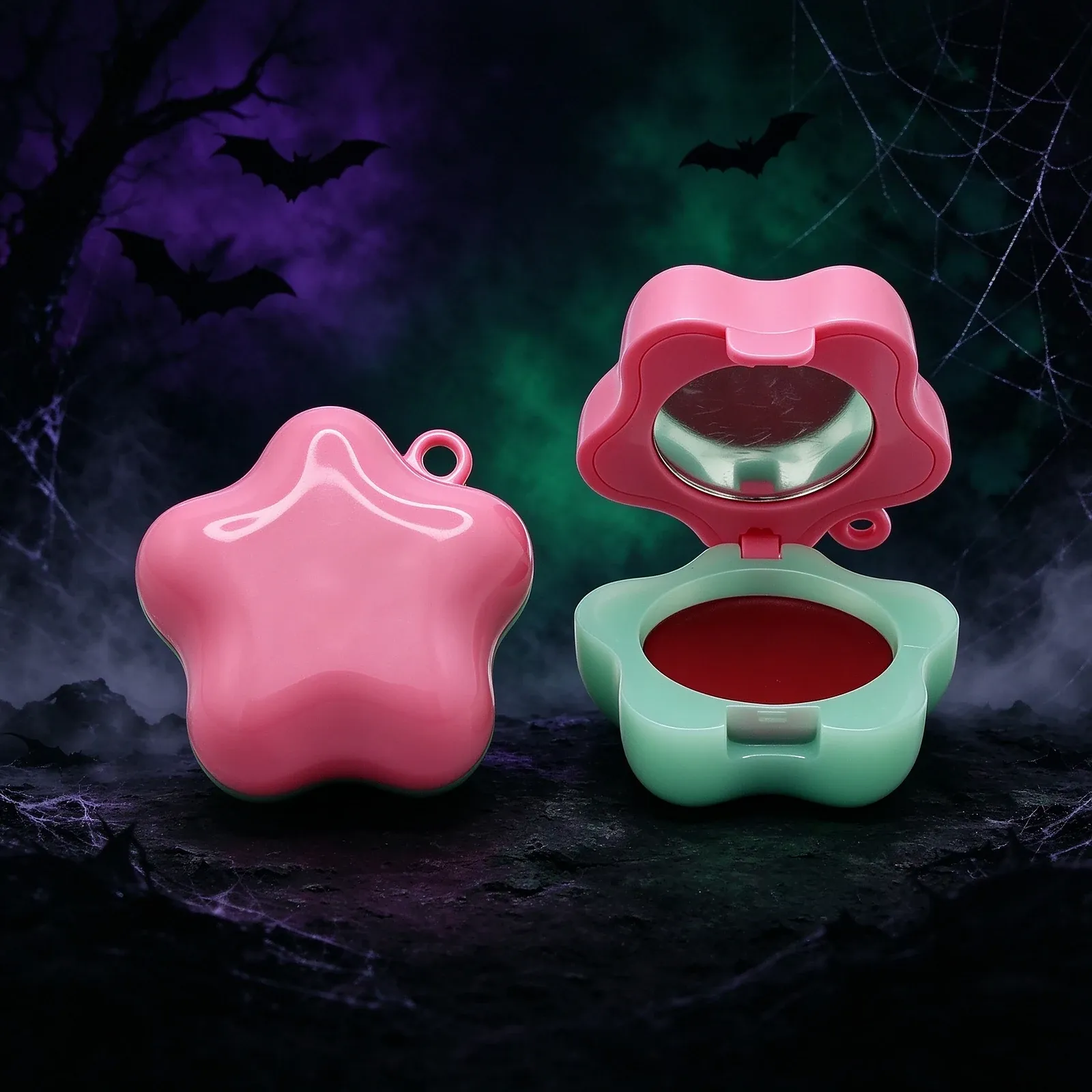 Star Colour Compact - A pink star-shaped compact with a small hanging loop, holding a solid glossy red pan in a pale-green base, with a mirror in the lid.