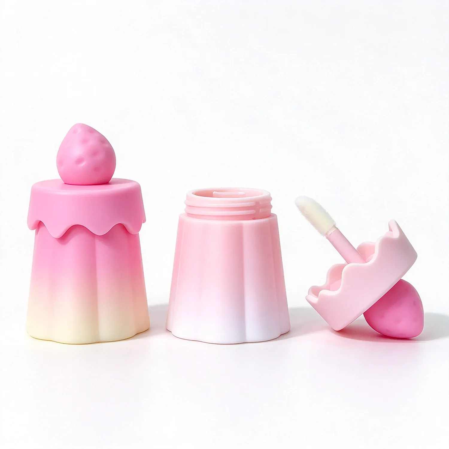 Gradient ice cream cone shaped lip glosses in pink and cream
