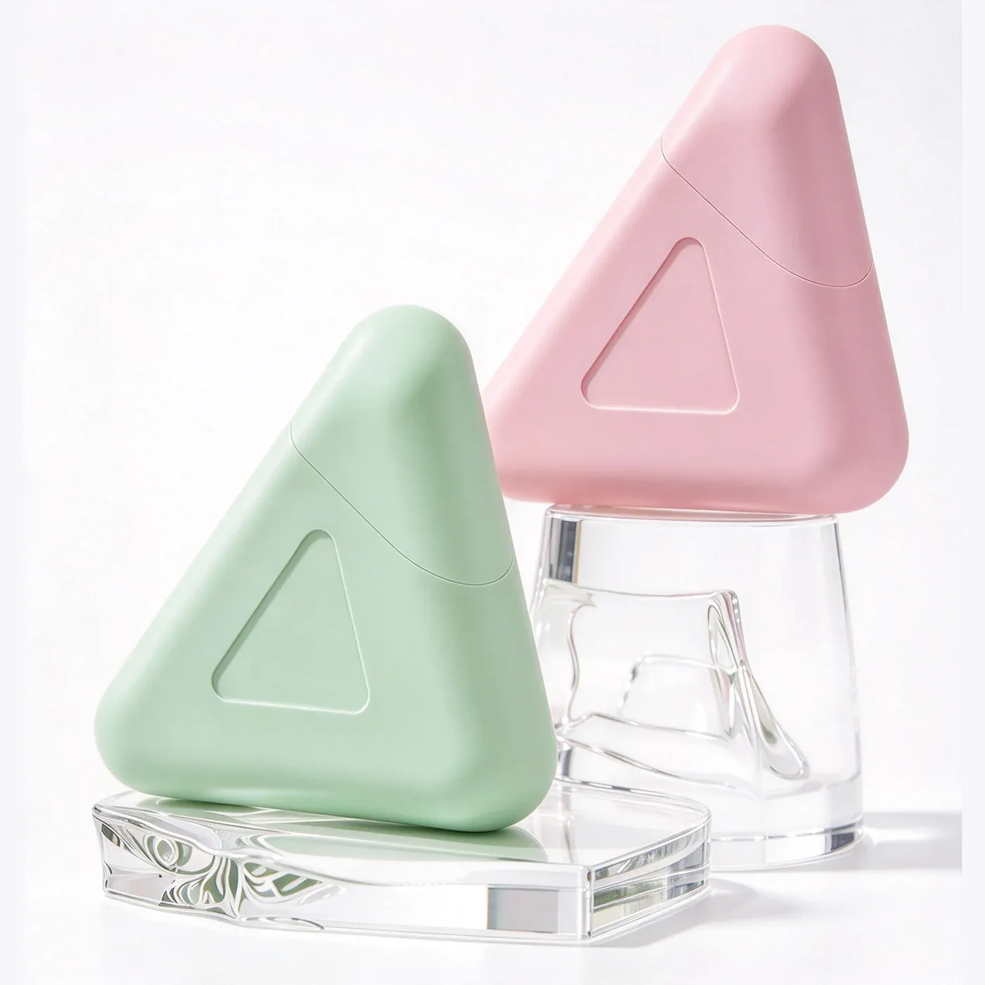 Green and pink triangle hand cream duos with clear caps