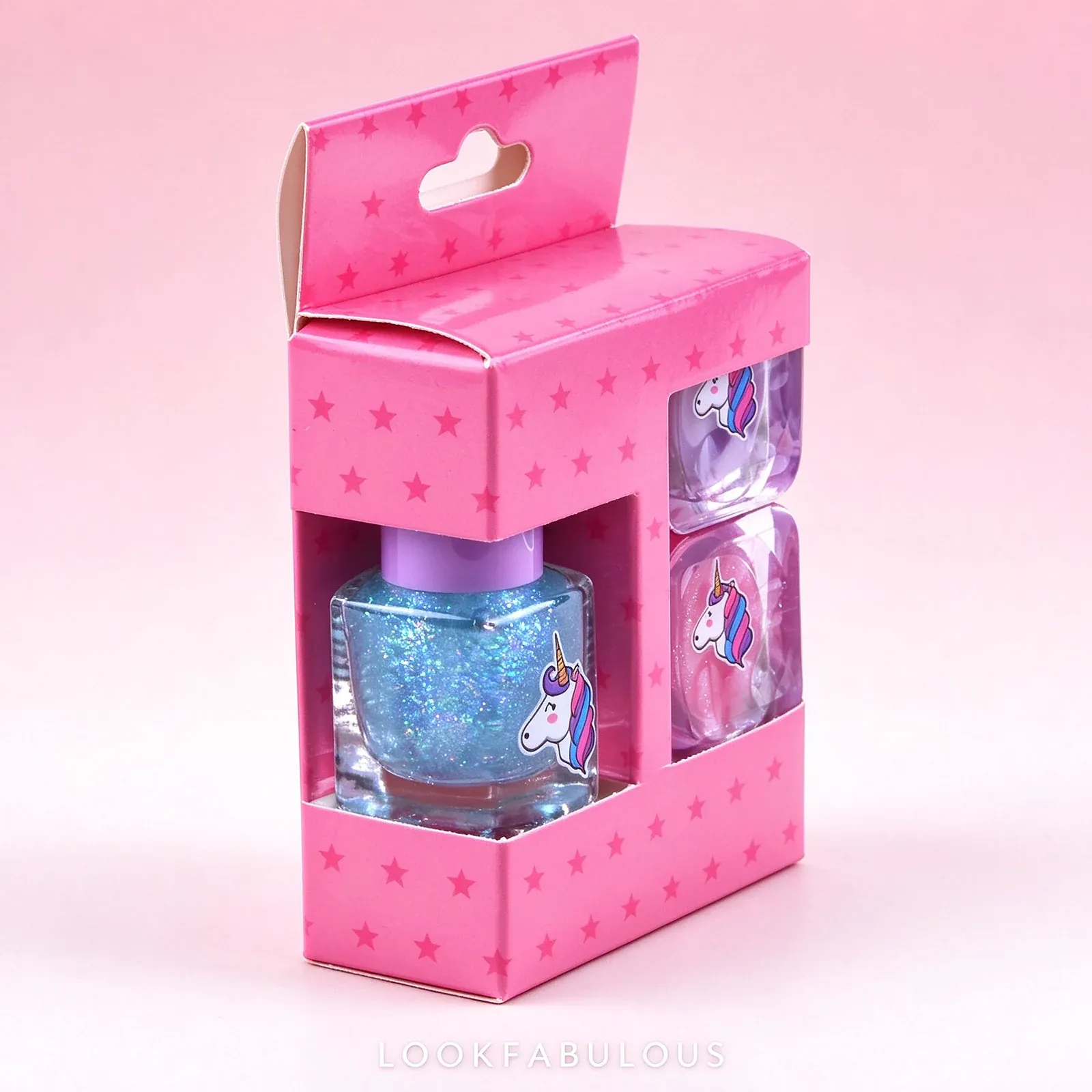 Pink star print carry box with a clear window holding the blue square polish and two rounded square unicorn pots