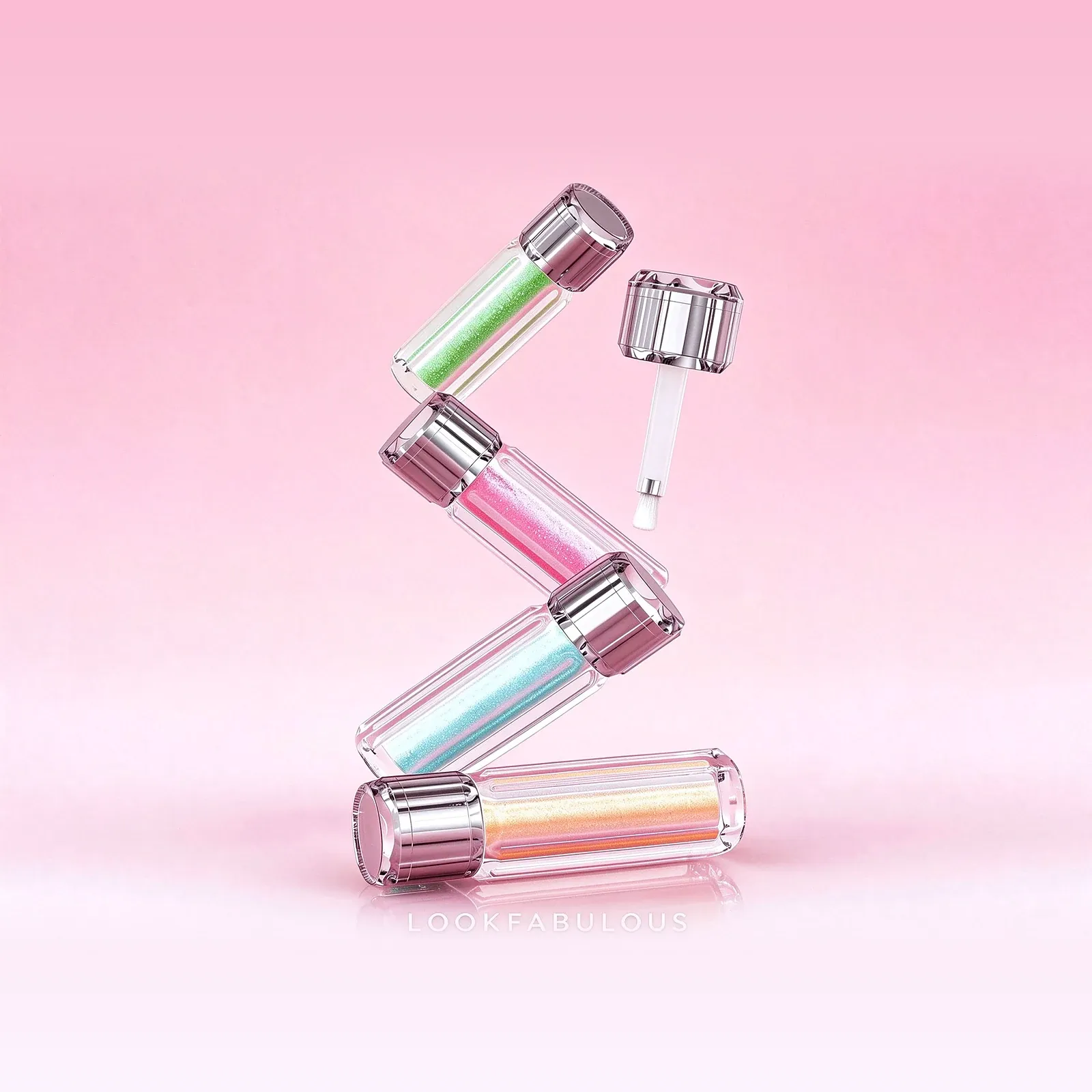 Four clear tubes of green, pink, blue and gold shimmering liquid tint with metallic caps