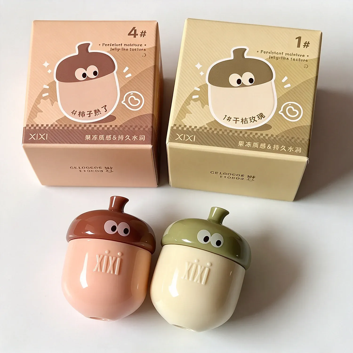 Two acorn-shaped lip balm pots with cartoon eyes in printed boxes, persimmon brown and olive green