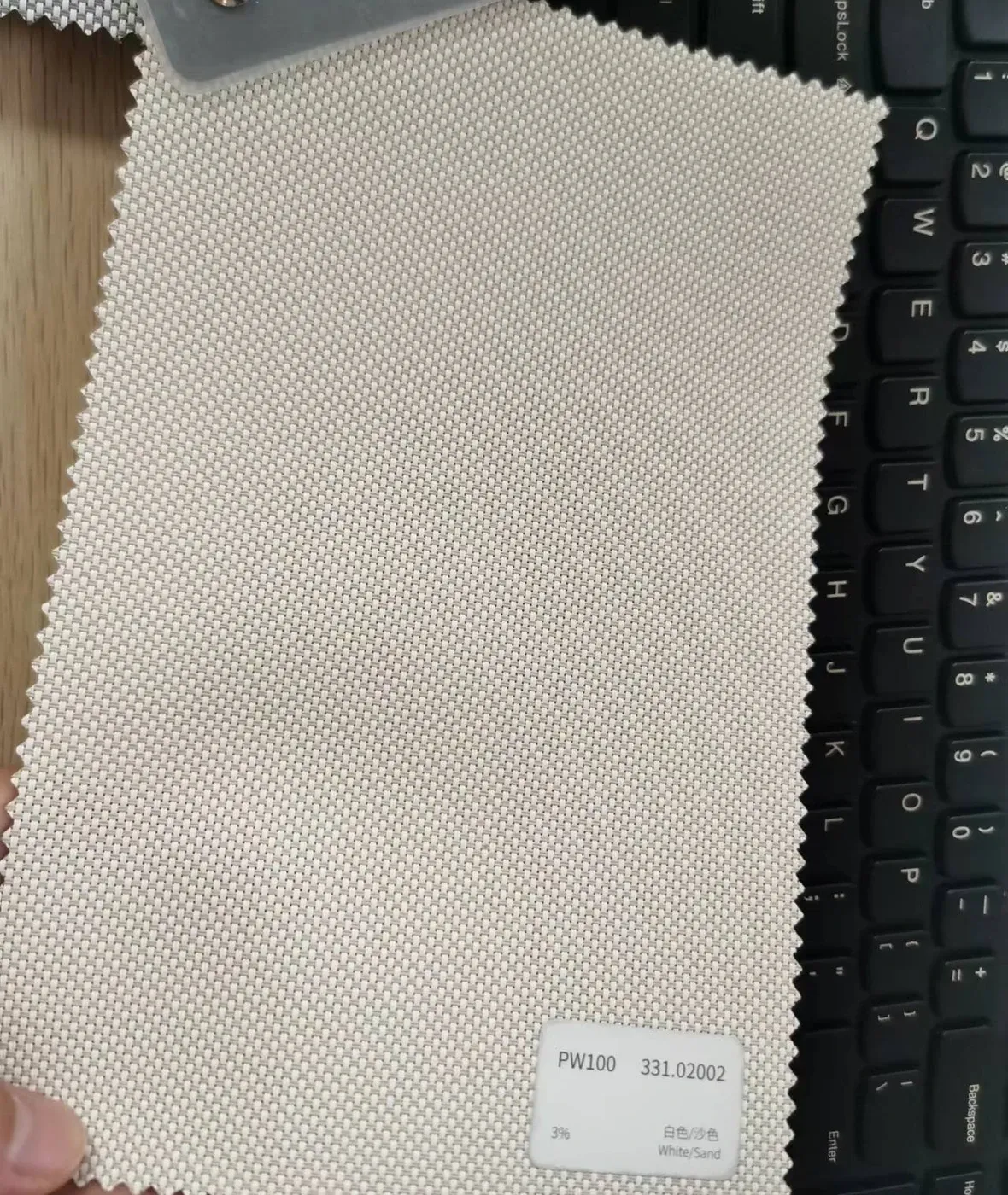 PW100 fabric colour swatch 331.02002 white sand, a 3% openness screen weave for outdoor roller blinds.