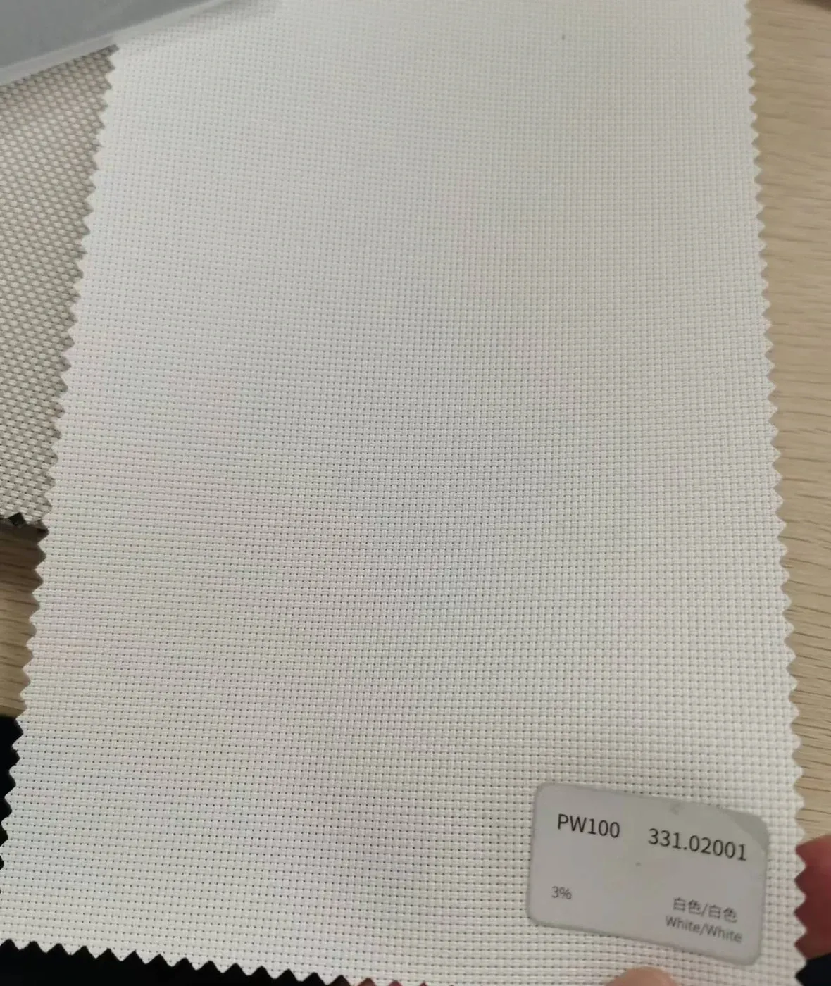 PW100 fabric colour swatch 331.02001 white, a 3% openness screen weave for windproof roller blinds.
