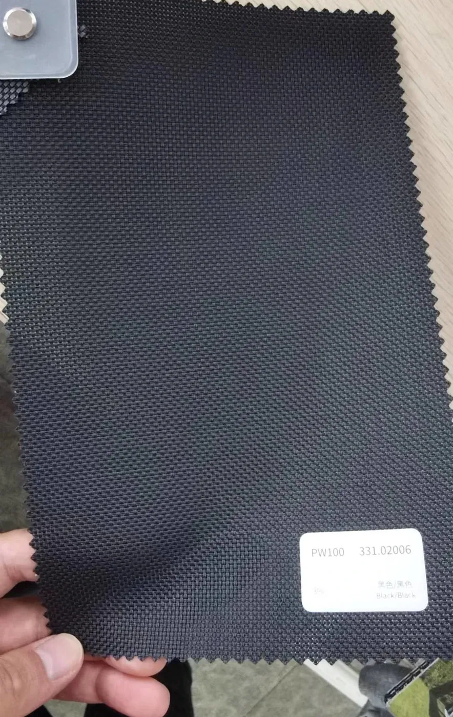 PW100 fabric colour swatch 331.02006 black, a 3% openness screen weave in a dark yarn.