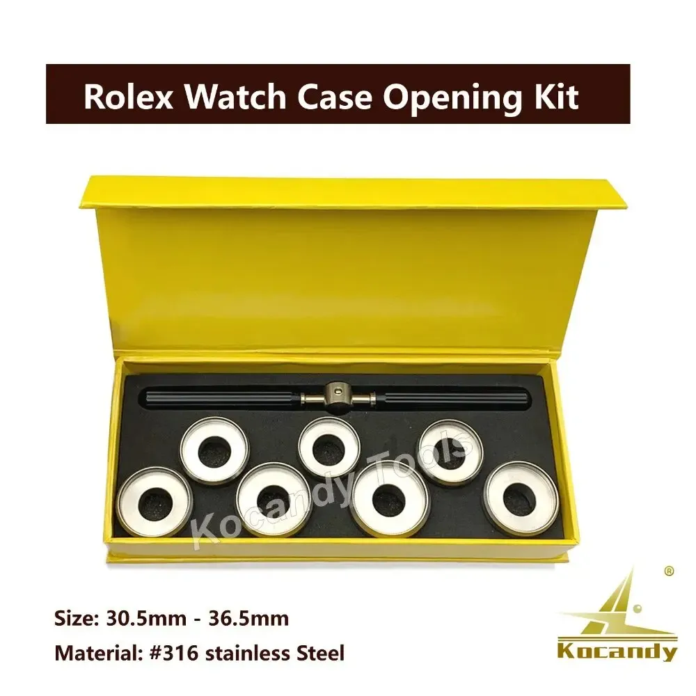 Yellow storage box containing six silver watch case opener dies