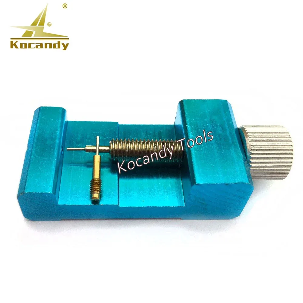 Blue adjustable pin remover with a gold pin lying underneath