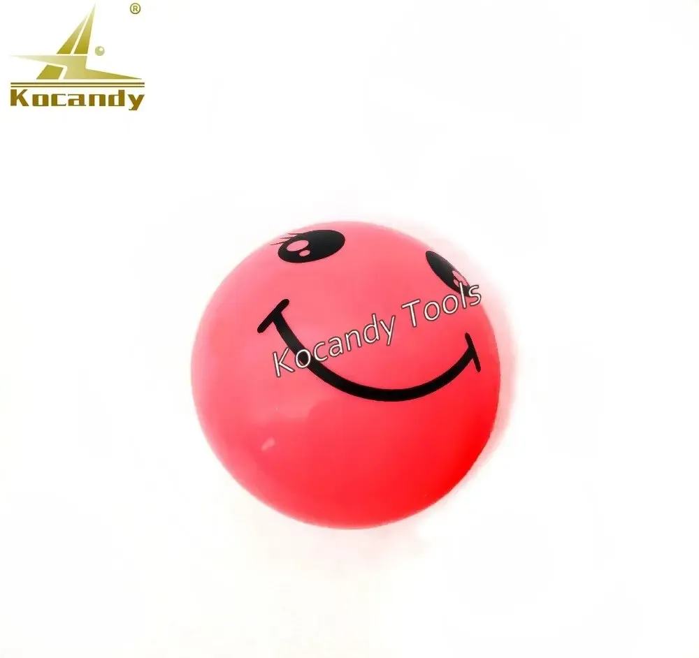 Pink silicone ball opener with a smiley face, close up
