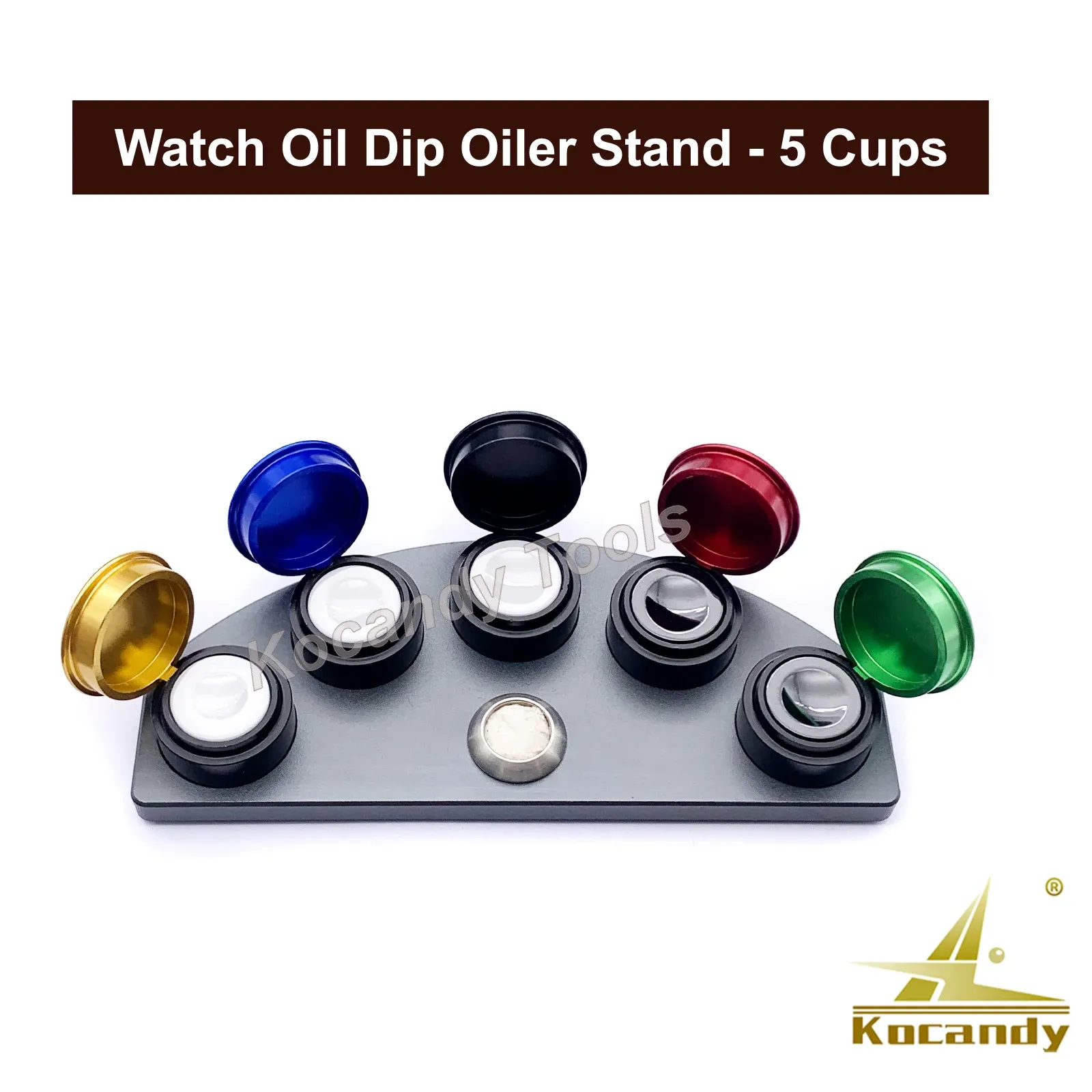 Five oiler dishes with coloured lids set in the black stand with tweezers