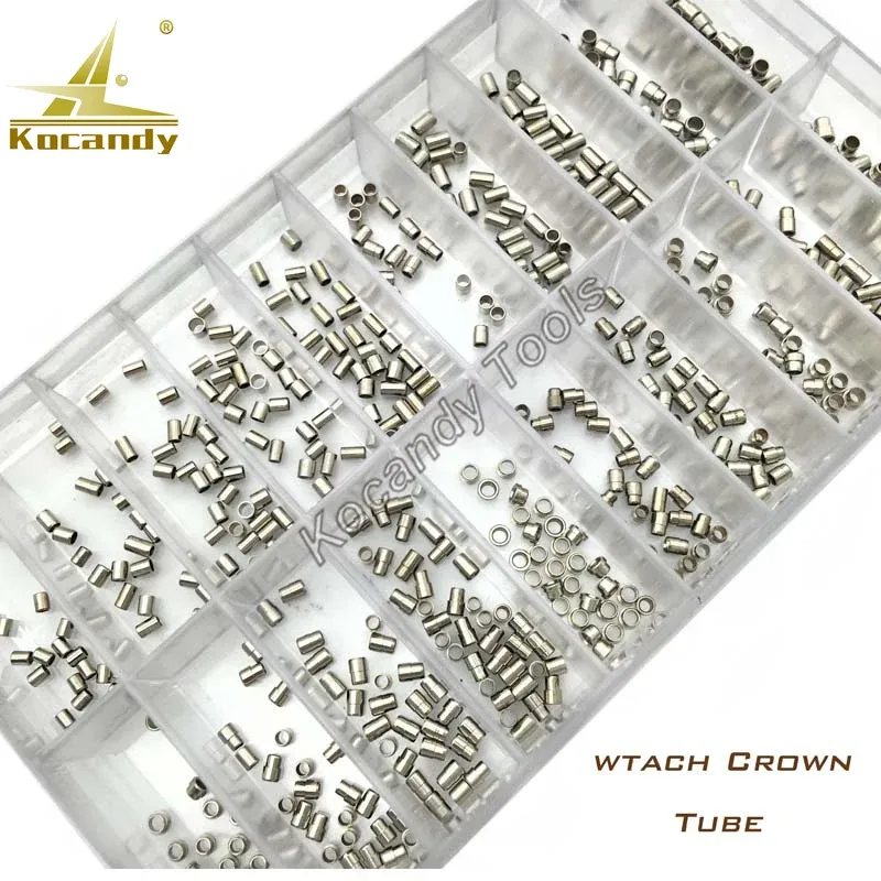 Stainless steel watch crown tubes in a clear tray beside a yellow ruler