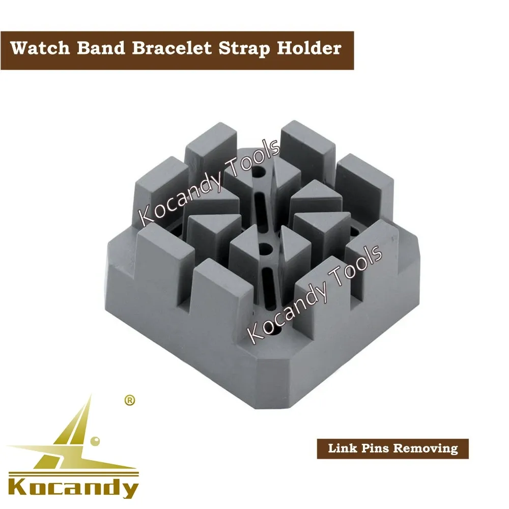 Grey strap holder block with two claw tips on top