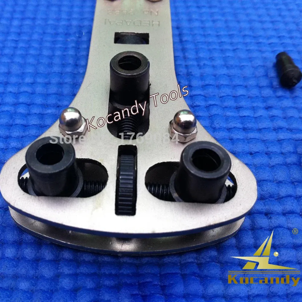 Case opener wrench upright with black dies laid out around it