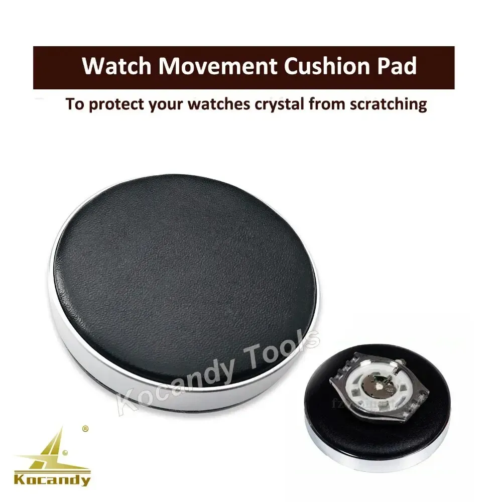 Black round cushion pad with a small black disc resting beside it