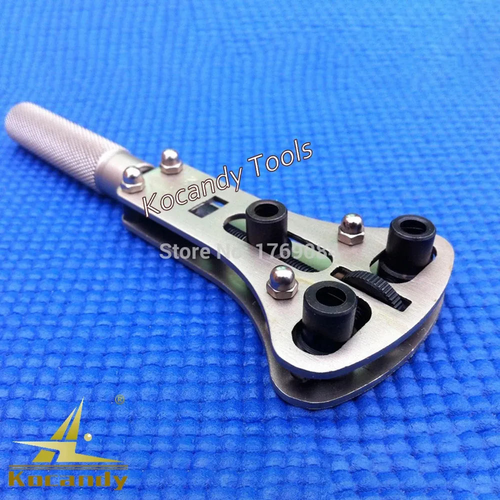 Case opener wrench laid flat beside a row of black dies