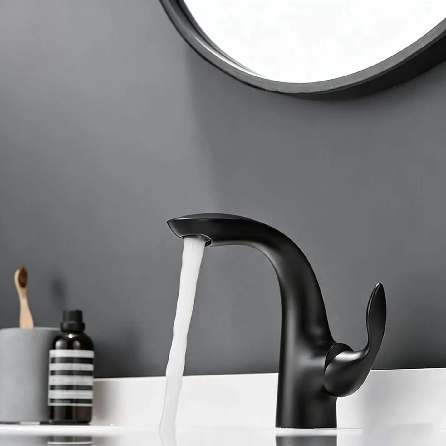 curved basin faucet black running water