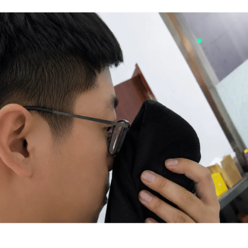 QC inspector smelling a textile product during pre-shipment odor check