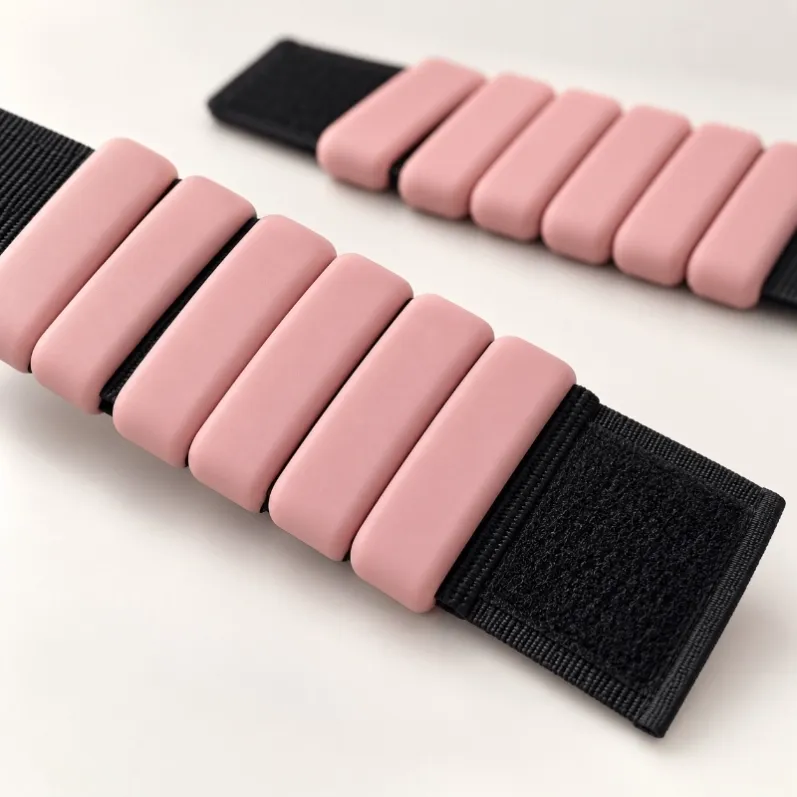 Close-up of silicone-covered weight blocks and adjustable hook-and-loop strap