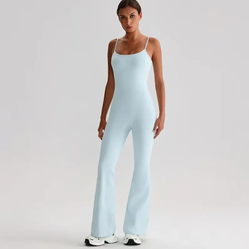 White full-length women's yoga jumpsuit with scoop neckline and flared legs