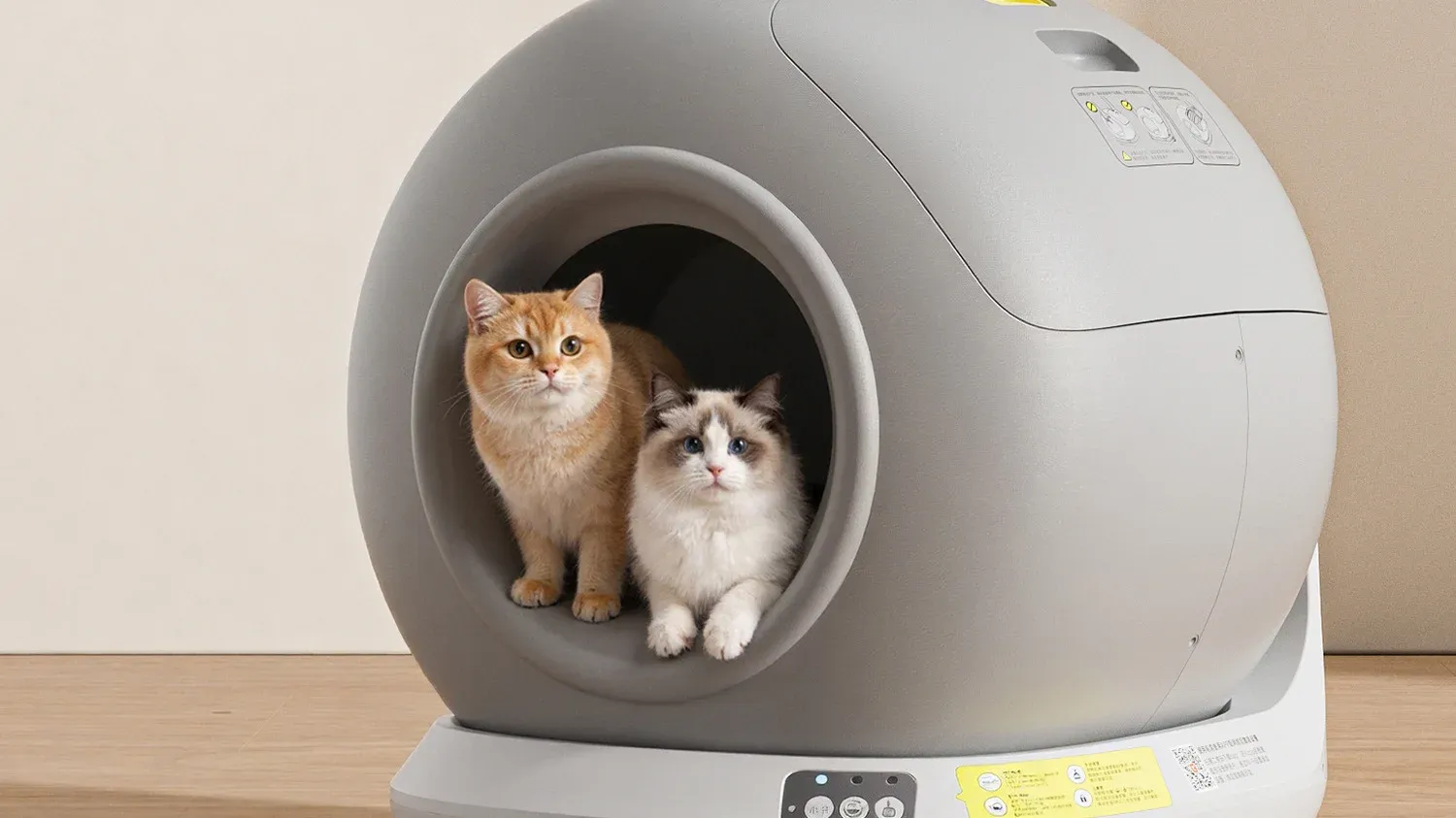 Smart self-cleaning litter box with two cats - 2026 pet product trends
