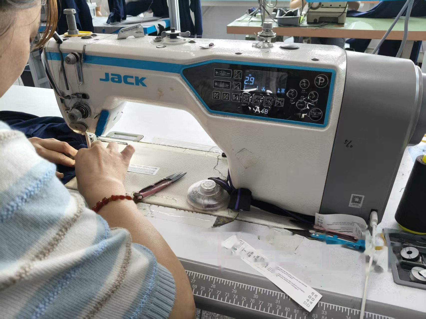 Fabric finishing station in activewear production