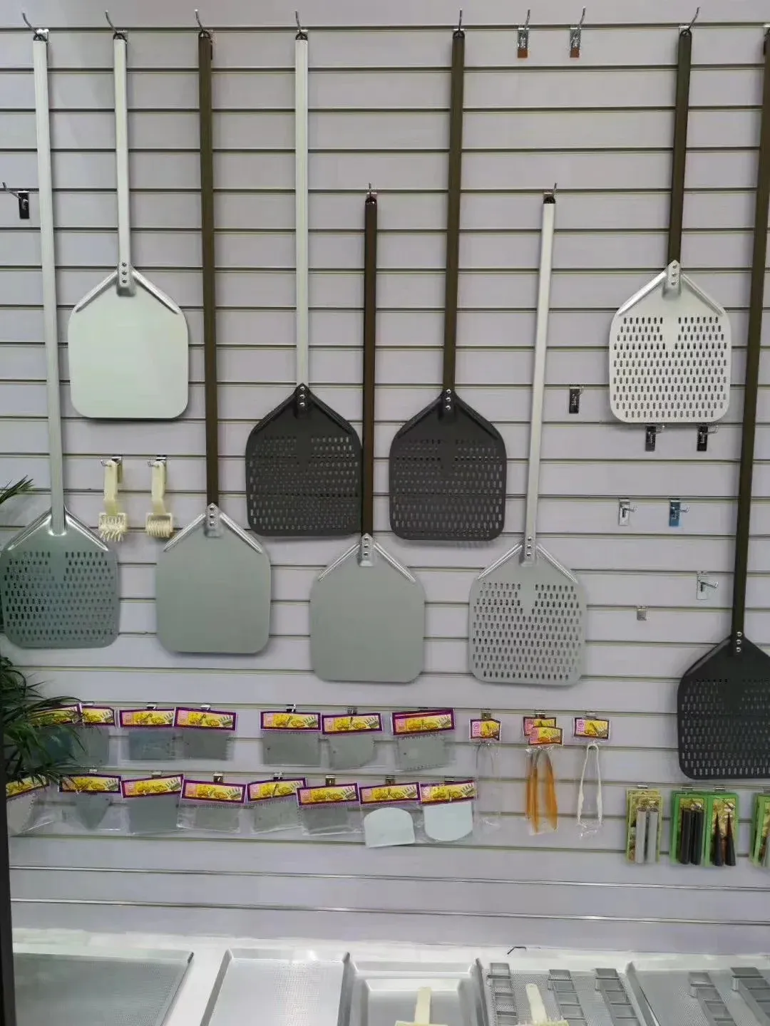 Pizza peel models displayed for range and specification review