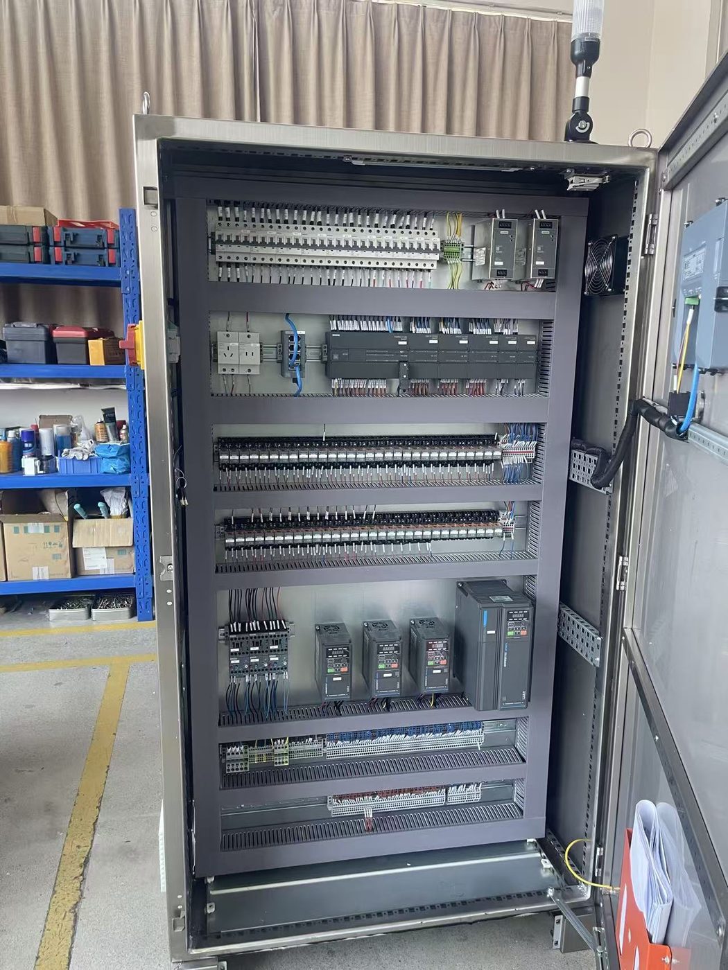 Interior of a VFD control panel with drive modules and wired terminals