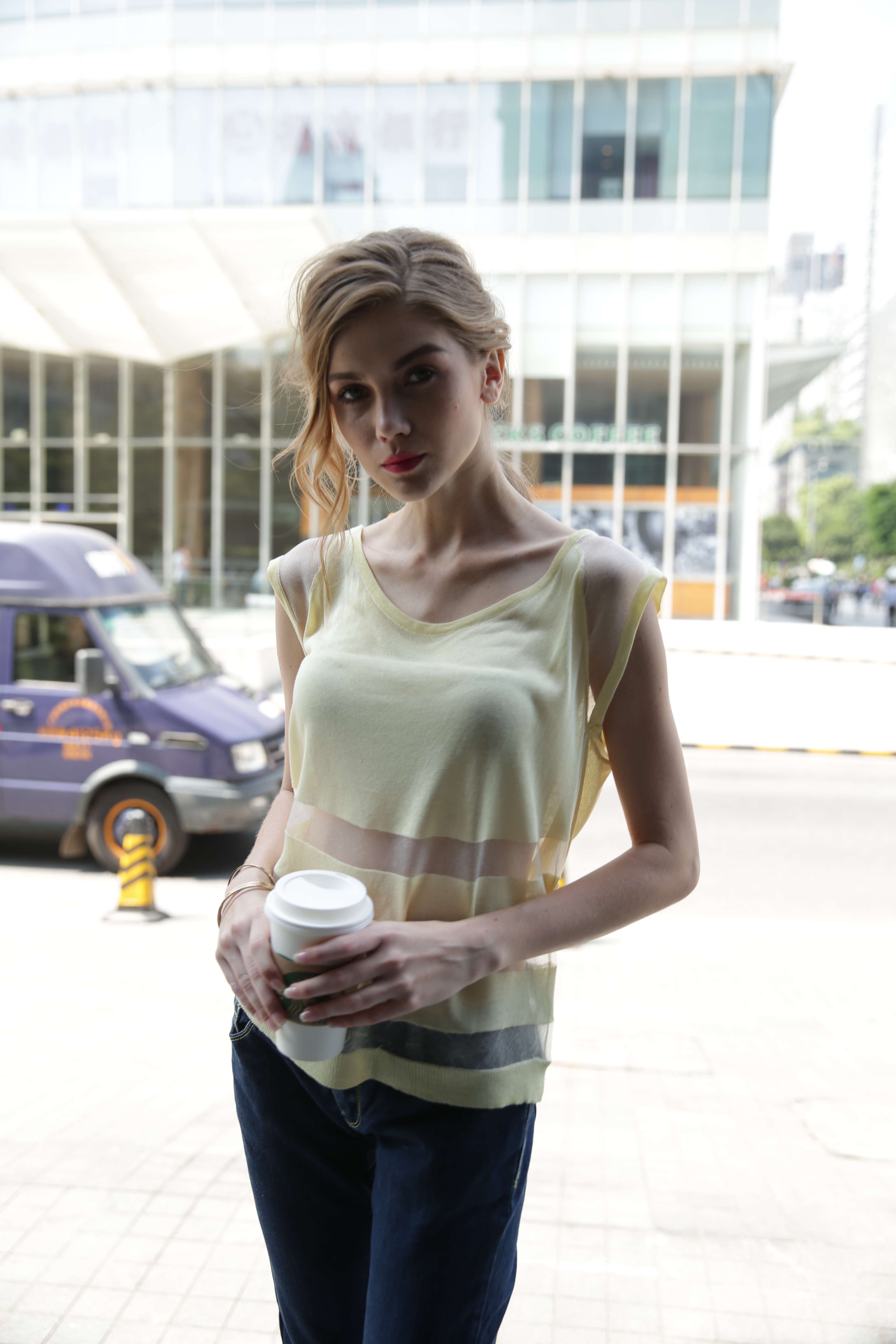 Side profile shot of women's knitted pullover IMP101 demonstrating comfortable hem and sleeve drape