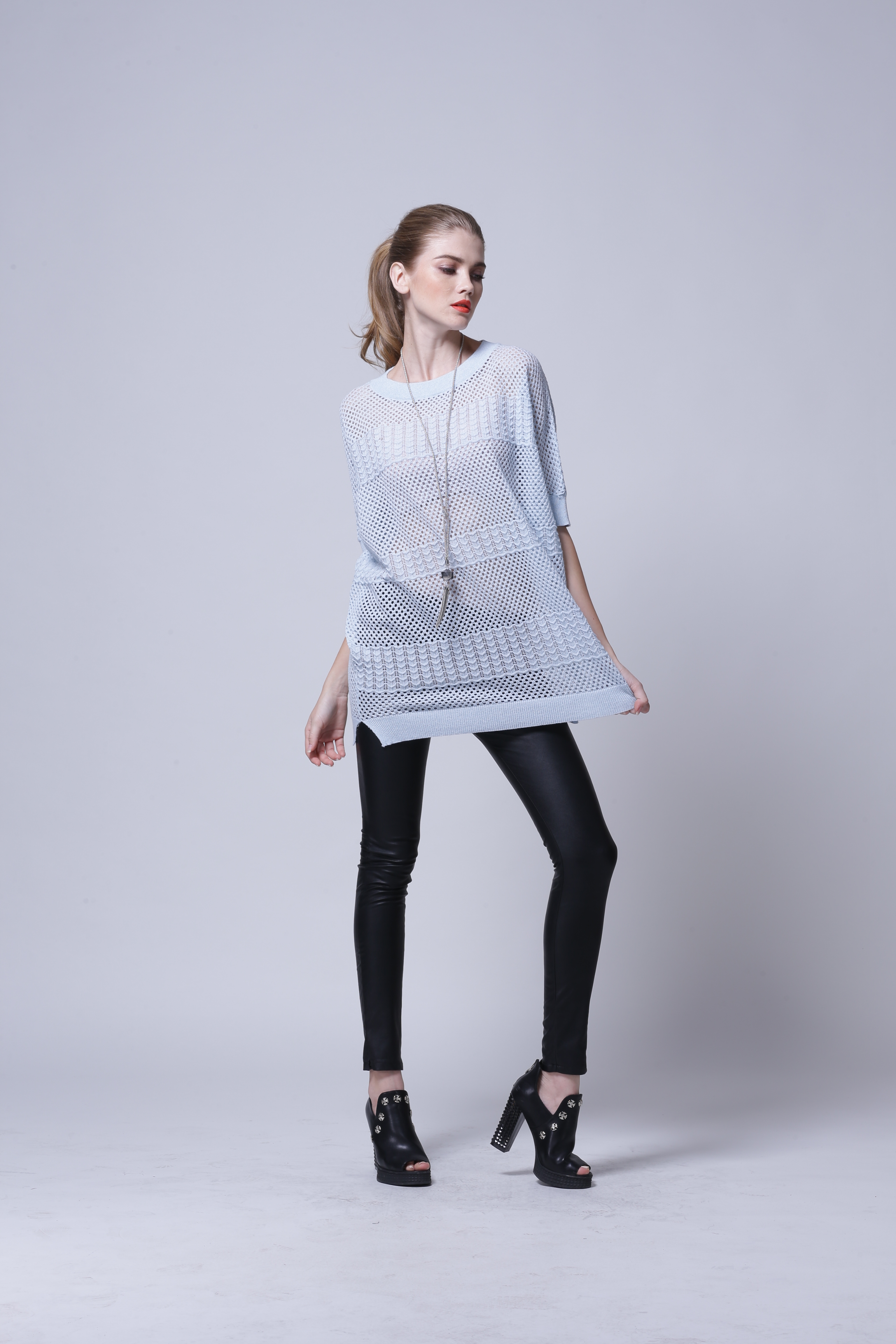 Detailed knit texture and surface craftsmanship on pullover IMP112
