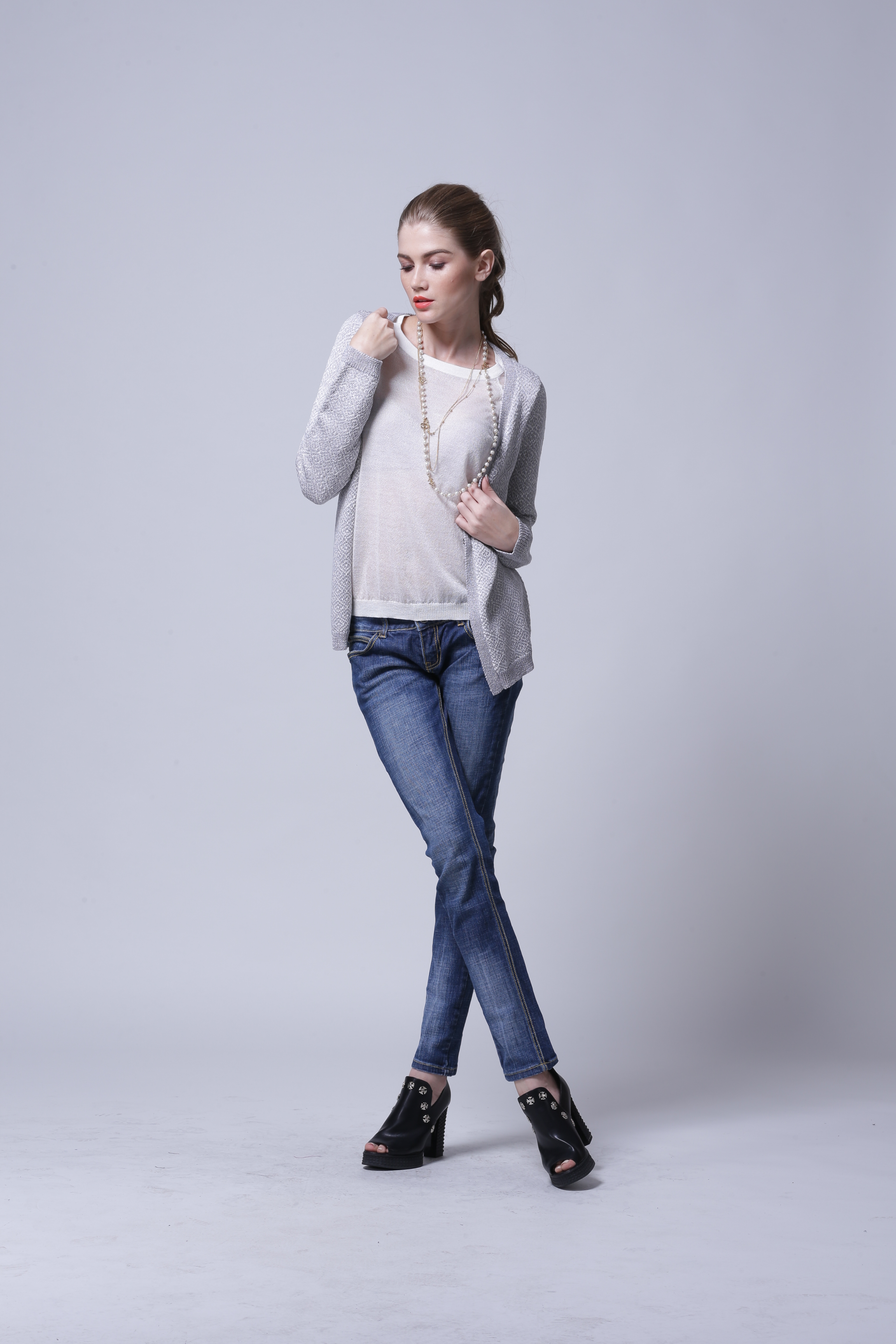 Side view illustrating drape and silhouette of women's cardigan IMC109