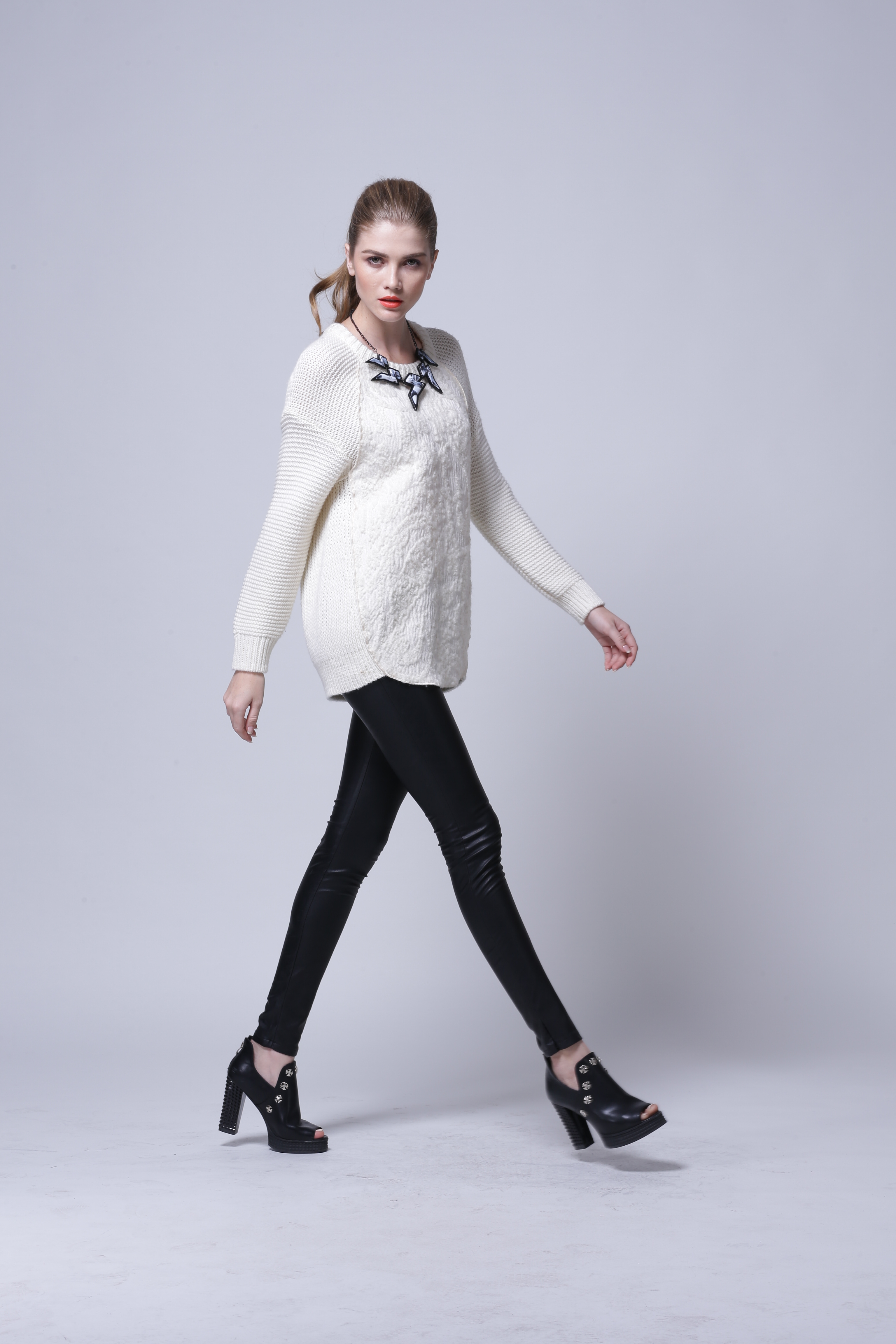 Clean front studio showcase of women's knitted pullover IMP113