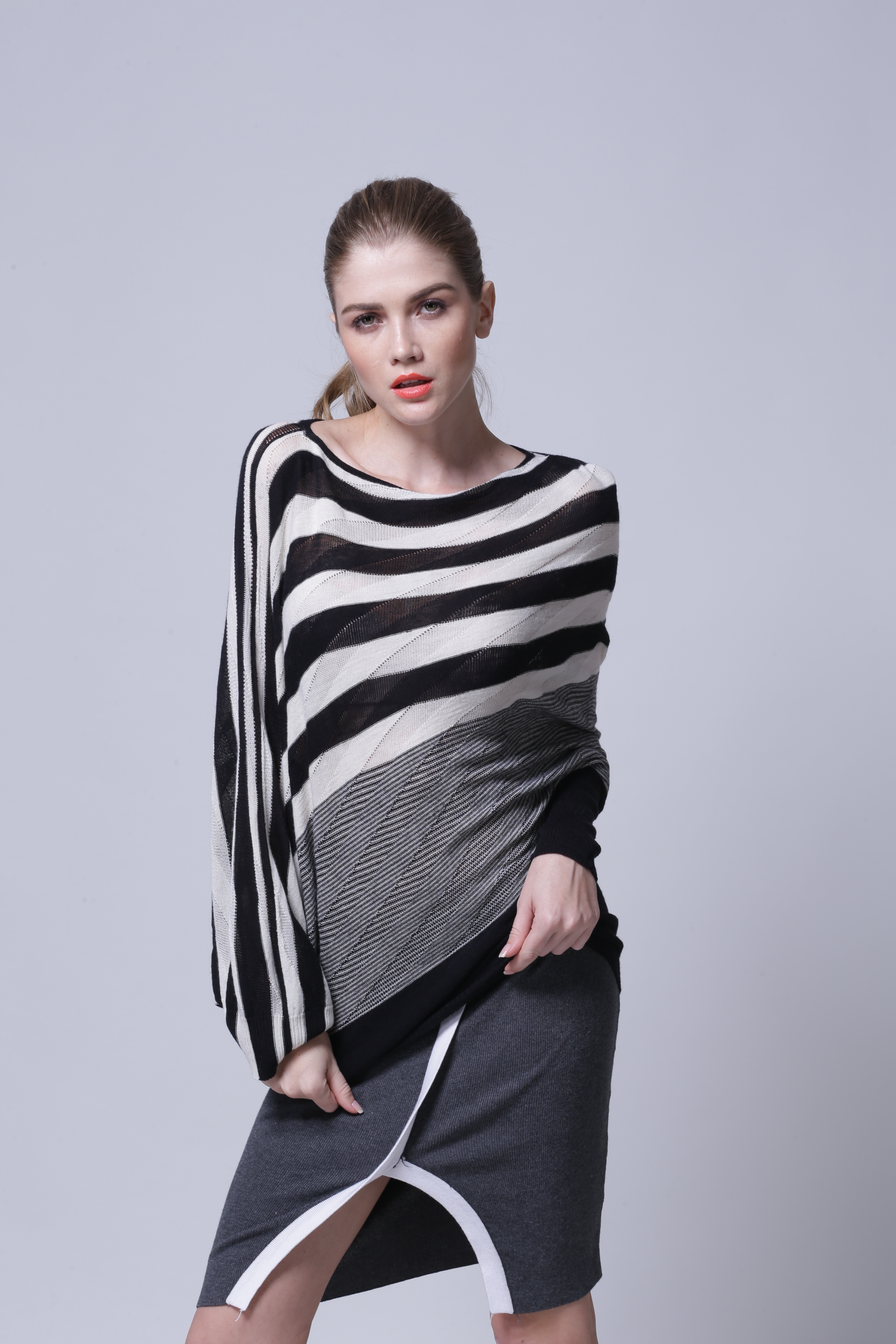 Back view presentation of women's knitted pullover IMP117 showing clean hem finish