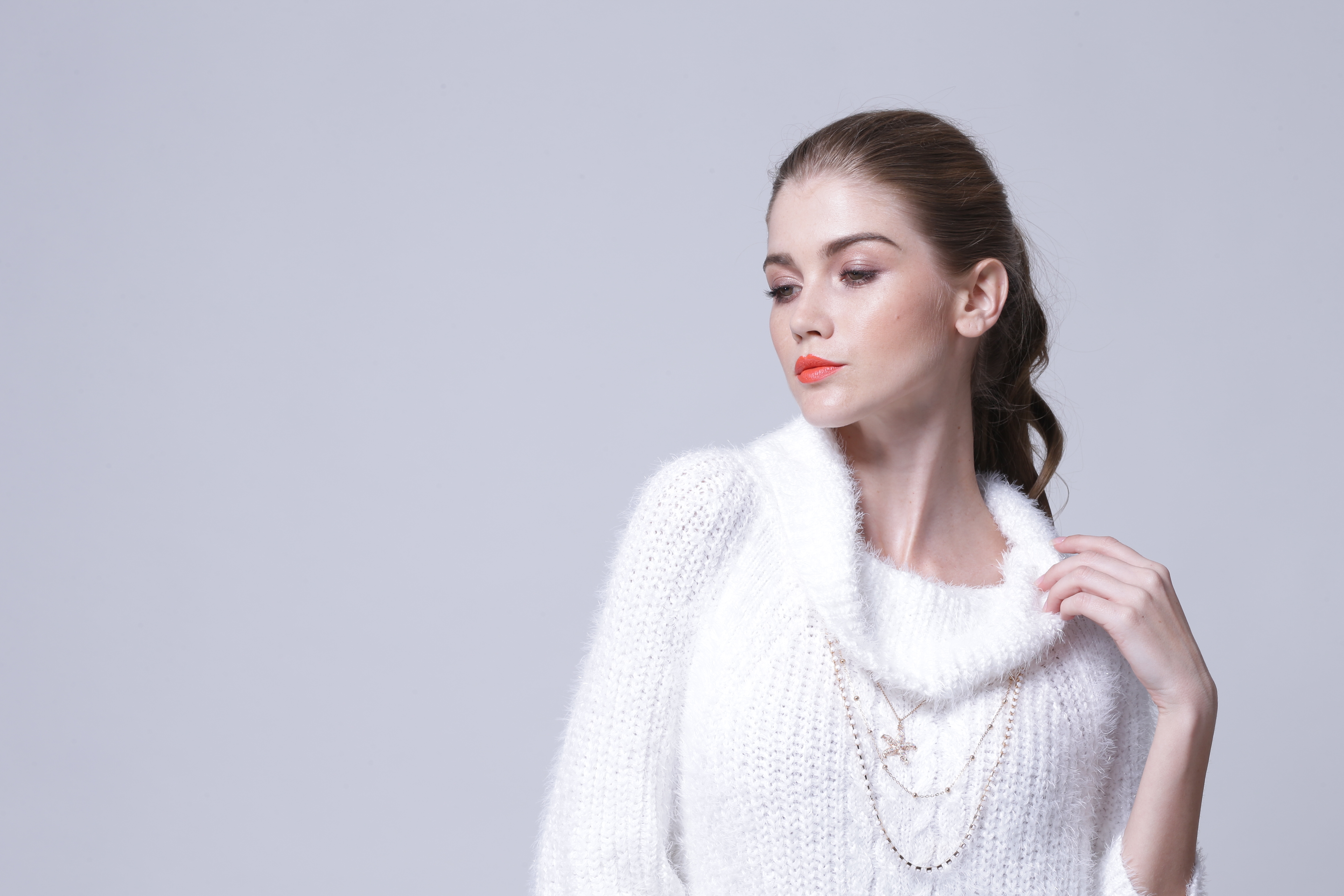 Clean back angle studio view of women's knitted pullover IMP111