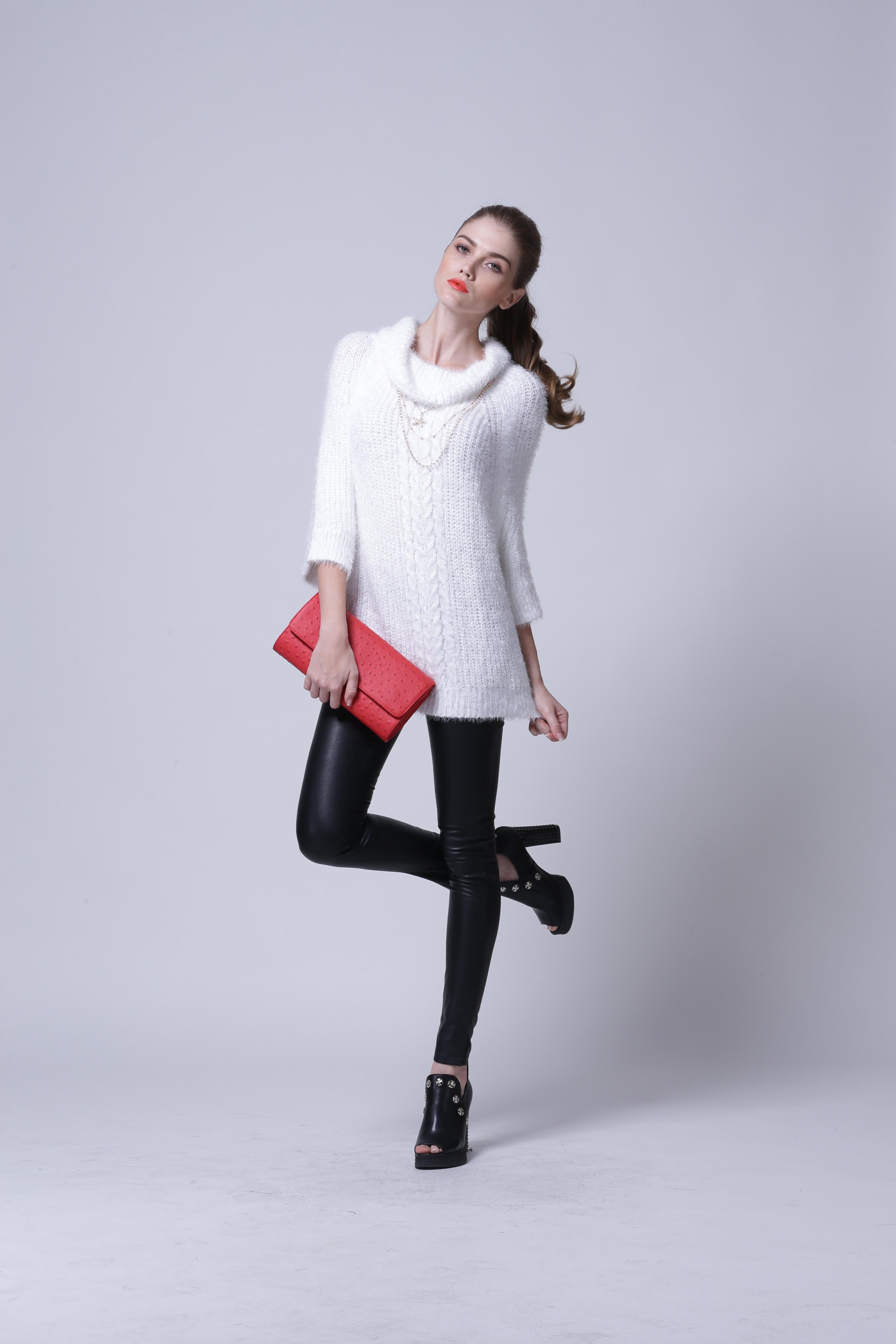 Side profile perspective of women's knitted pullover IMP111 drape