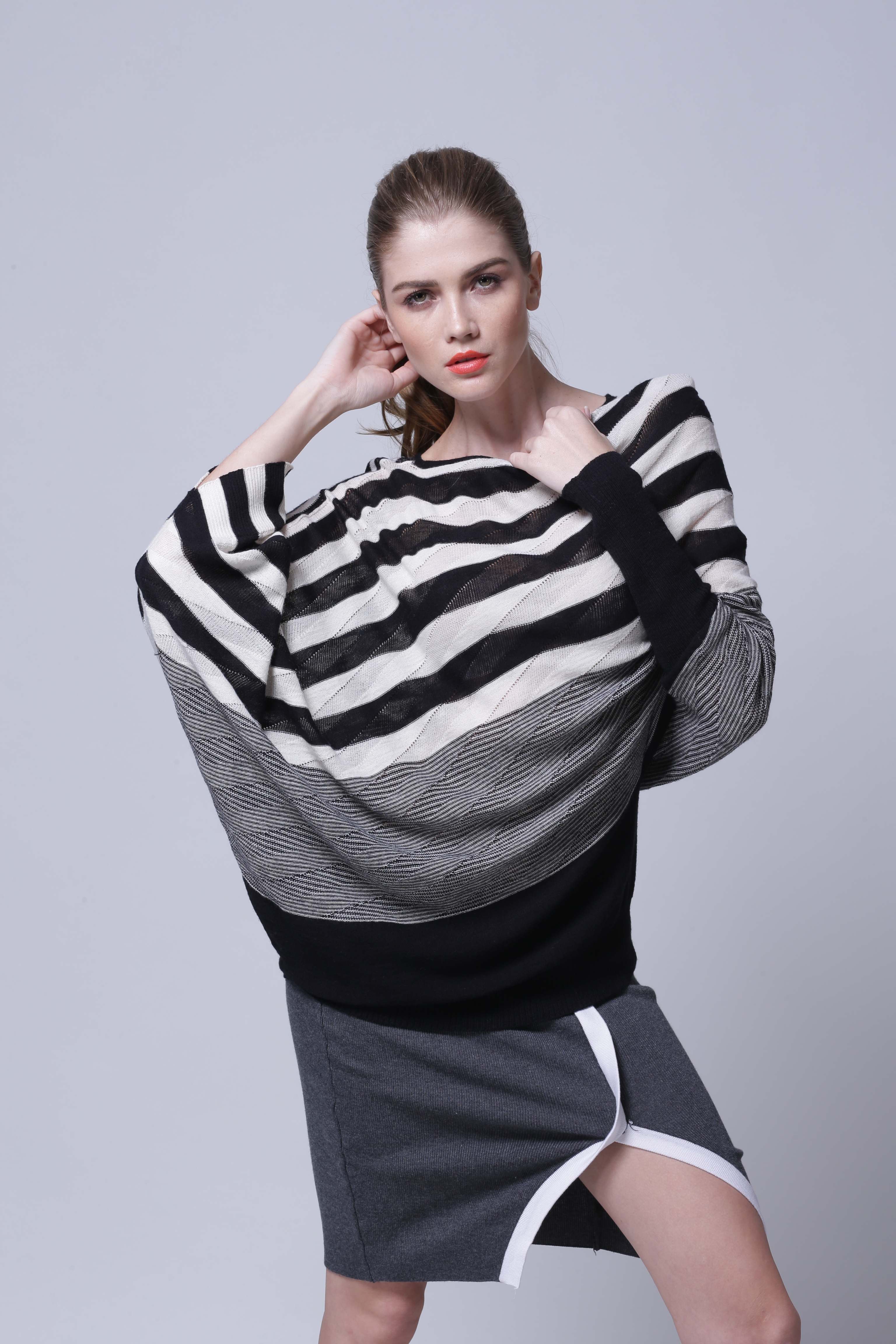 Women's knitted pullover IMP117 styled in versatile layered look for boutique buyers