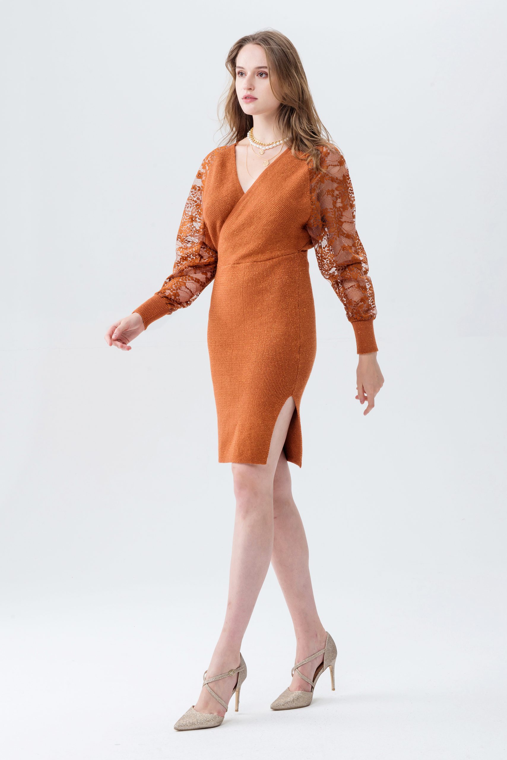 Rust knitted wrap dress with a V-neckline and sheer lace sleeves.